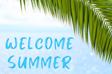 Fototapeta na wymiar Welcome summer text on the background with palm leaf and blue sea. Template of a greeting card, postcard or advertisement of a tour agency. 