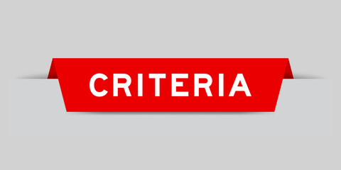 Red color inserted label with word criteria on gray background