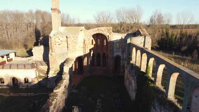 Ruins of a monastery in Moreruela, Zamora, Spain. XII-XIII century buiding of the christian monastic cluny order. Aerial drone shot, camera getting close.