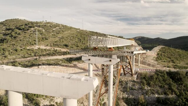 Drone fly-by motion video over a new bridge&acute;s structure under construction in Barranco de la Bota in Morella