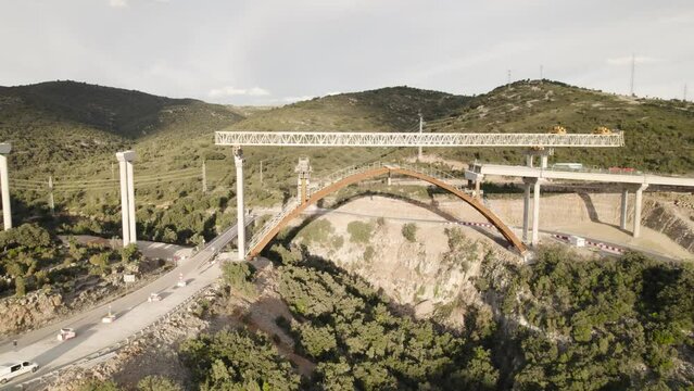 Orbital drone motion video revealing a new bridge&acute;s structure under construction in Barranco de la Bota in Morella