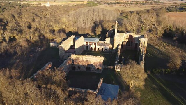 Aerial drone shot of monastery in ruins in Moreruela, Zamora, Spain. XII-XIII century buiding of the christian monastic cluny order. Camera getting close.