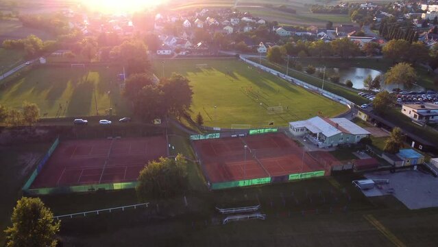 Zistersdorf Athletic Field With People Playing Soccer At Sunset In Lower Austria. - aerial