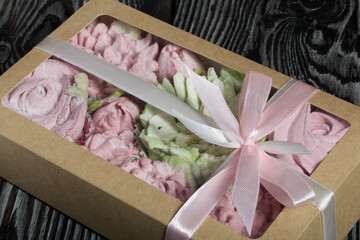 Roses, tulips and chrysanthemums from marshmallows. Zephyr flowers. In craft packaging. Tied with ribbon.