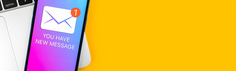 Banner, you have new message text notification on a mobile phone screen close-up view. Business...