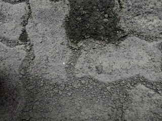 cracked and dirty brick paving roads