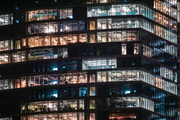 Fototapeta na wymiar Office building with glass facade - night photograph