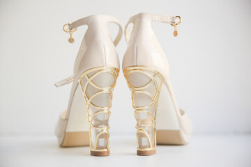 Pair of wedding shoes with decorated heels