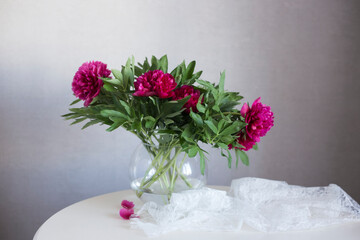 Peonies in a vase on the table