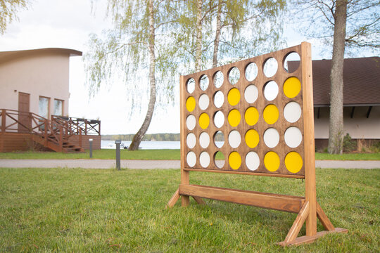 Giant connect four in a line garden wooden game