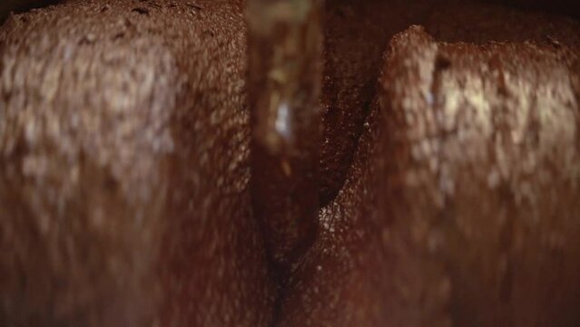Industrial Machine Conching And Refining Dark Chocolate. Modern Process Of Chocolate Making. macro