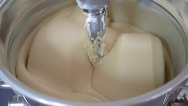 White Chocolate Mixture In A Conching Machine To Remove Astringency. close up