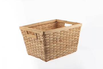 Stack of wicker straw osier handmade baskets different size and pattern at isolated white...