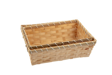 Stack of wicker straw osier handmade baskets different size and pattern at isolated white background for home storage. A set of wicker baskets of different sizes. Handmade.