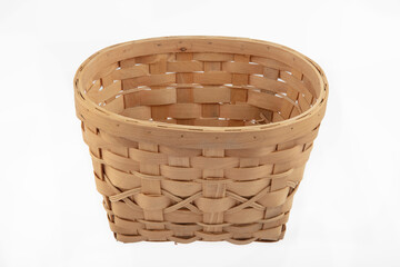 Stack of wicker straw osier handmade baskets different size and pattern at isolated white...