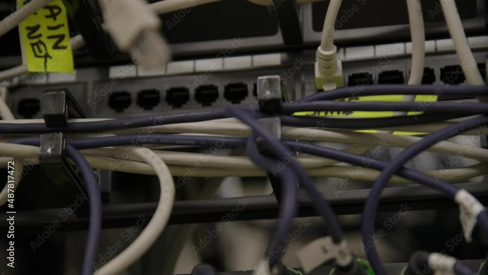 Poster ethernet cables plugged into modern internet network switch