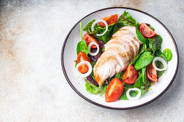 easter salad chicken breast with vegetables tomato, onion, green lettuce mix leaves veggie fresh portion healthy meal food diet snack on the table copy space food background rustic keto or paleo diet