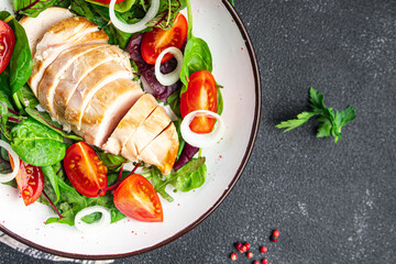 easter salad chicken breast with vegetables tomato, onion, green lettuce mix leaves veggie fresh portion healthy meal food diet snack on the table copy space food background rustic keto or paleo diet
