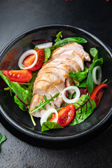 easter salad chicken breast with vegetables tomato, onion, green lettuce mix leaves veggie fresh portion healthy meal food diet snack on the table copy space food background rustic keto or paleo diet