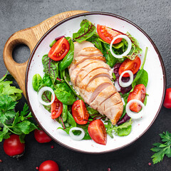 easter salad chicken breast with vegetables tomato, onion, green lettuce mix leaves veggie fresh portion healthy meal food diet snack on the table copy space food background rustic keto or paleo diet