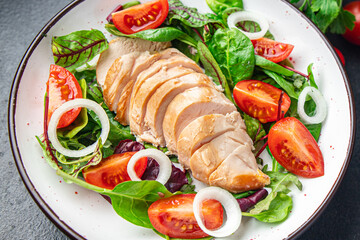 easter salad chicken breast with vegetables tomato, onion, green lettuce mix leaves veggie fresh portion healthy meal food diet snack on the table copy space food background rustic keto or paleo diet