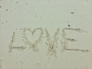 Love written on the sand beach. Happy Valentines day.