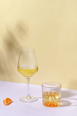 Artistic still life with two different glasses of white wine
