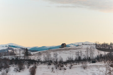 Spectacular sunset evening in Transylvania, Romania is the ideal time to go out and capture beautiful aerial photography. Sunset aerial with Moeciu and Bran in Brașov County, Transylvania, Romania