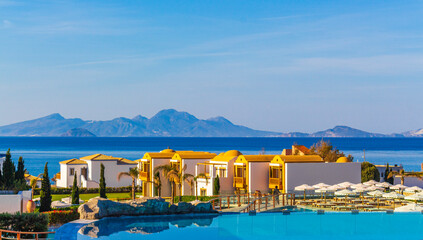 Resorts and beaches with sun loungers and umbrellas Kos Greece.