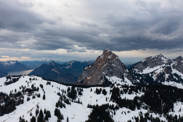 Fototapeta premium Amazing shot of a beautiful landscape in the alps of Switzerland. Wonderful flight with a drone over an amazing landscape in the canton of Schwyz. Epic view at a mountain called Grosser Mythen.