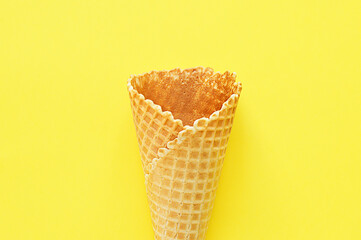 waffle cup empty close up on yellow background