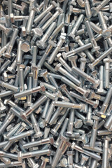 metal fasteners bolt background. top view