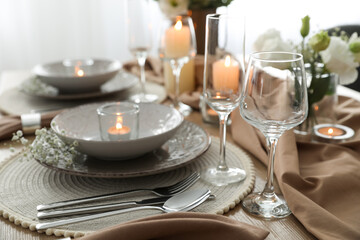 Festive table setting with beautiful floral decor in restaurant