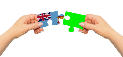 Woman hands are holding part of puzzle game. National mock up on white background. Fiji