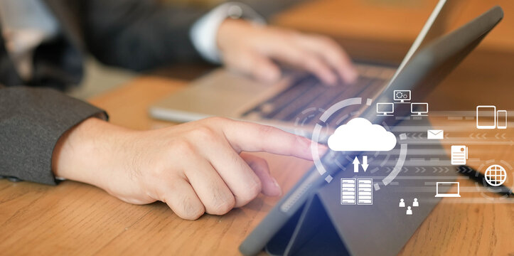 close up man hand typing on keyboard for transfer or synch data upload and download from cloud computing with virtual interface in operation room, technology business concept