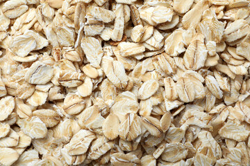 Pile of oatmeal as background, top view