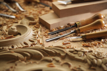 Woodworking tools. Carving wood with chisel. Carpenter's hands use chiesel