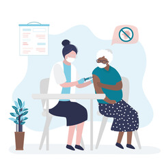 Nurse giving coronavirus vaccine to elderly patient. Doctor makes injection of medication. African american grandmother vaccinated against coronavirus. Healthcare concept.