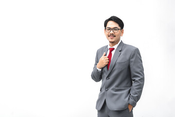 Asian standing near blank wall. Concept of businessman