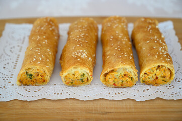 Iconic rustic Romanian and Moldavian pies with white seeds, spinach and cheese filing.