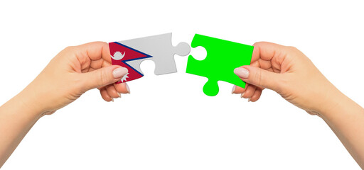Woman hands are holding part of puzzle game. National mock up on white background. Nepal