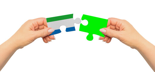 Woman hands are holding part of puzzle game. National mock up on white background. Sierra Leone