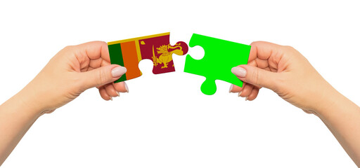 Woman hands are holding part of puzzle game. National mock up on white background. Sri Lanka