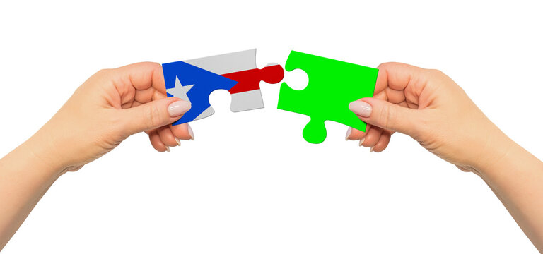 Woman hands are holding part of puzzle game. National mock up on white background. Puerto Rico