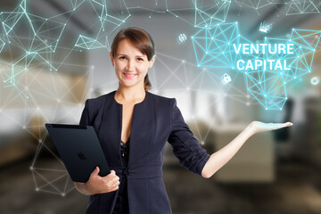 Business, Technology, Internet and network concept. Young businessman working on a virtual screen of the future and sees the inscription: Venture capital