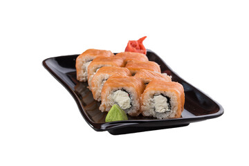 uramaki sushi roll philadelphia with salmon on black plate isolated on white background