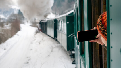 Moving steam train Mocanita from inside it in winter, Romania