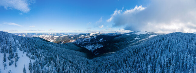 Aerial drone panoramic view of the winter Carpathians, Romania