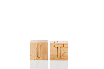 Wooden cubes with letters it on a white background