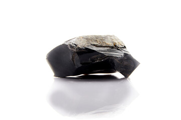 obsidian piece on white background Obsidian, sometimes called volcanic glass, is a type of igneous...